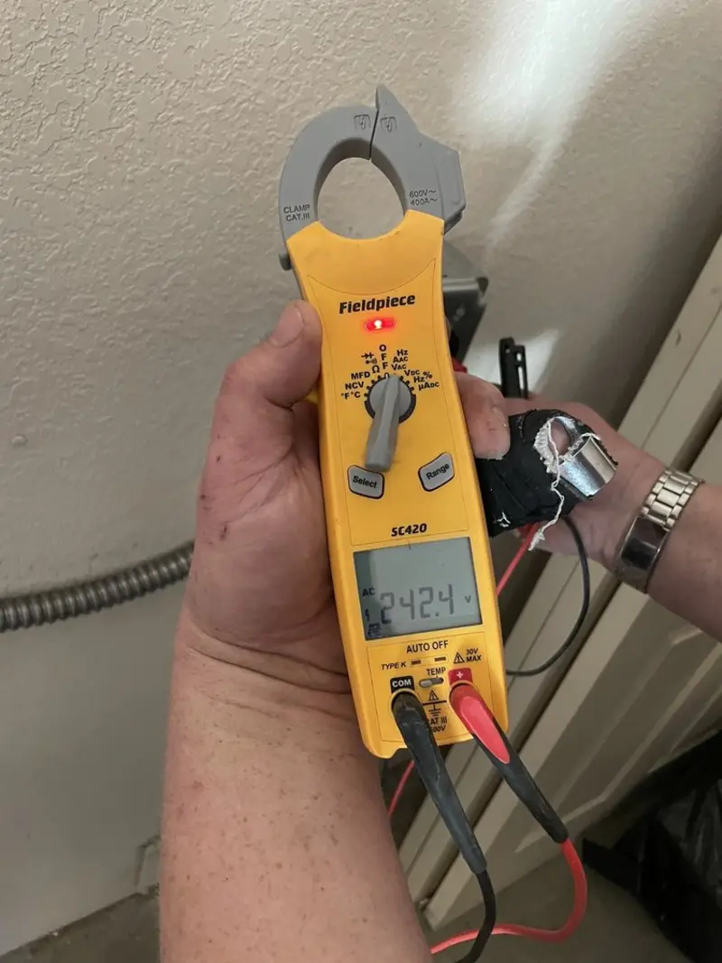 Voltage testing with clamp meter during Electrical Installation Services in East Greenbush
